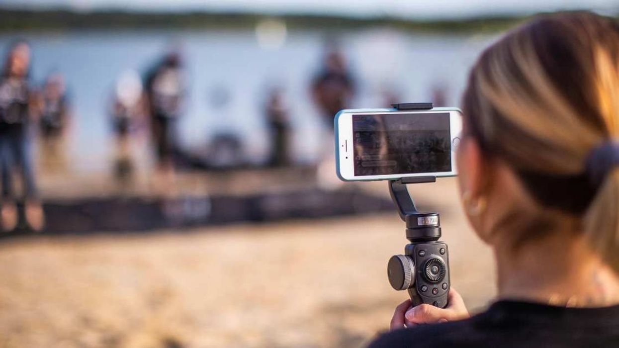 Bystanders recorded a stranger’s proposal but it's the commentary that has gone viral