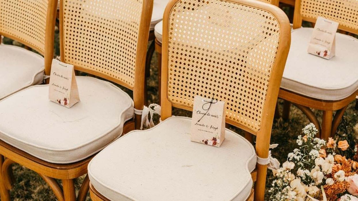 Bride leaves empty seat for late son but breaks down when she notices who's seated there