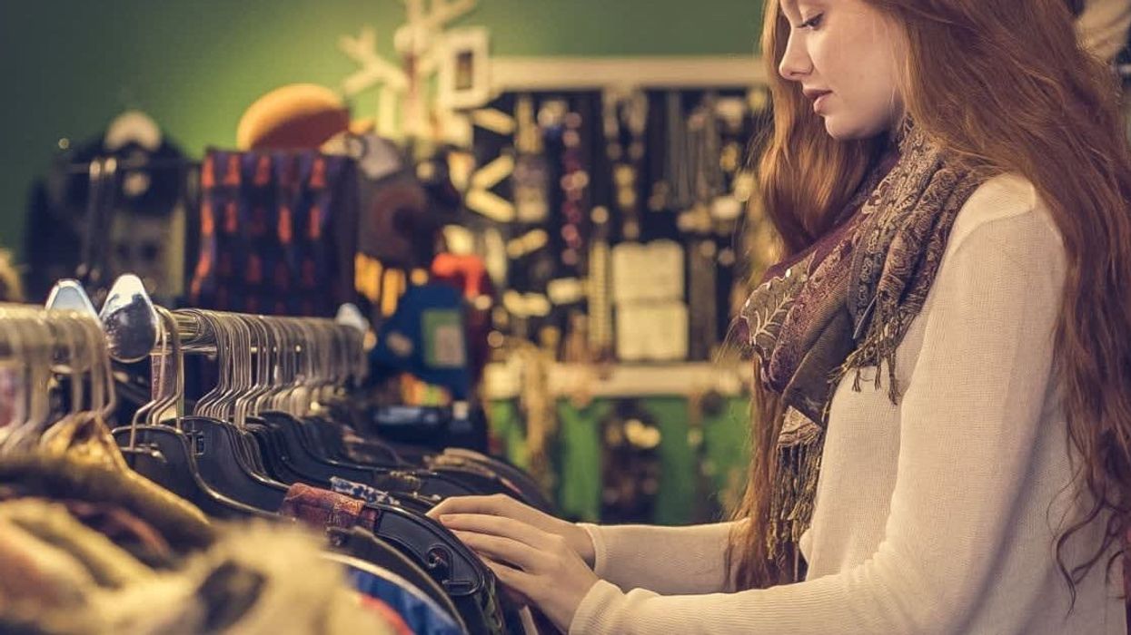 Woman finds an emotional tag attached to a sweater while shopping at a thrift store