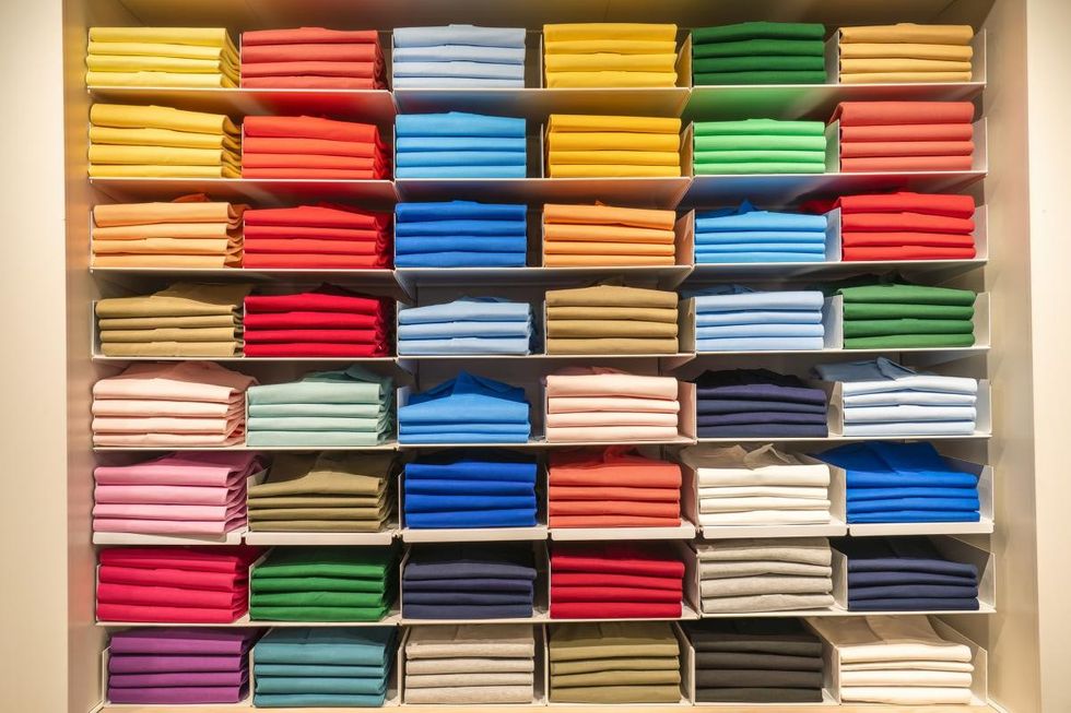 Representative Image Source: A collection of polo shirts and sweaters in all colors inside a wardrobe. (Getty Images)