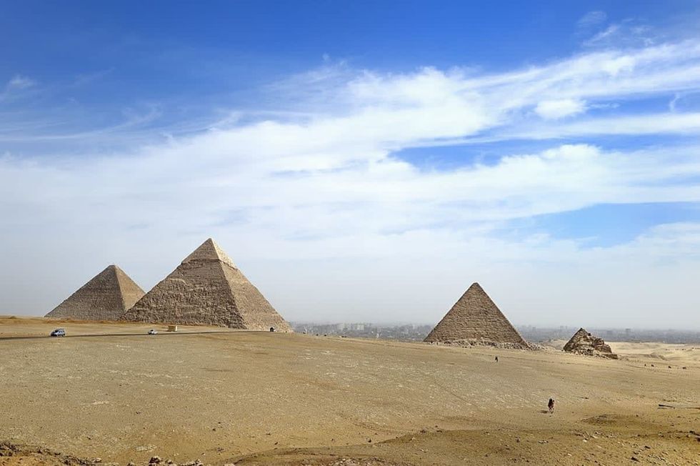Representative Image Source: A view of the pyramids at Giza from the plateau to the south of the complex. From left to right: the Great Pyramid of Khufu, the Pyramid of Khafre and the Pyramid of Menkaure.