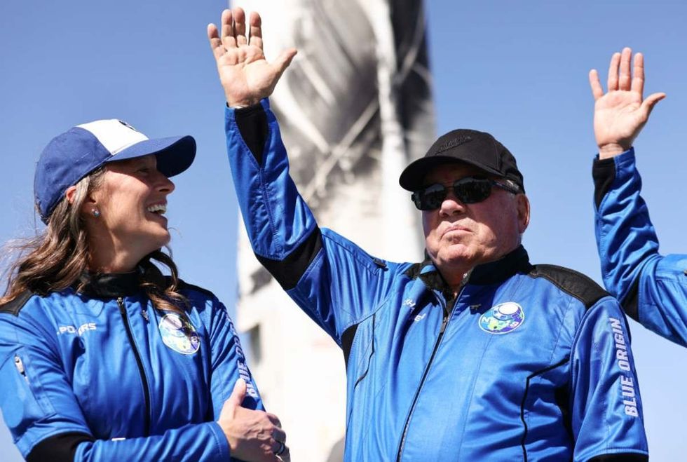 Representative Image Source: Blue Origins vice president of mission Audrey Powers (L) looks on as Star Trek actor William Shatner during a media availability on the landing pad of Blue Origin’s New Shepard. (Photo by Mario Tama/Getty Images)