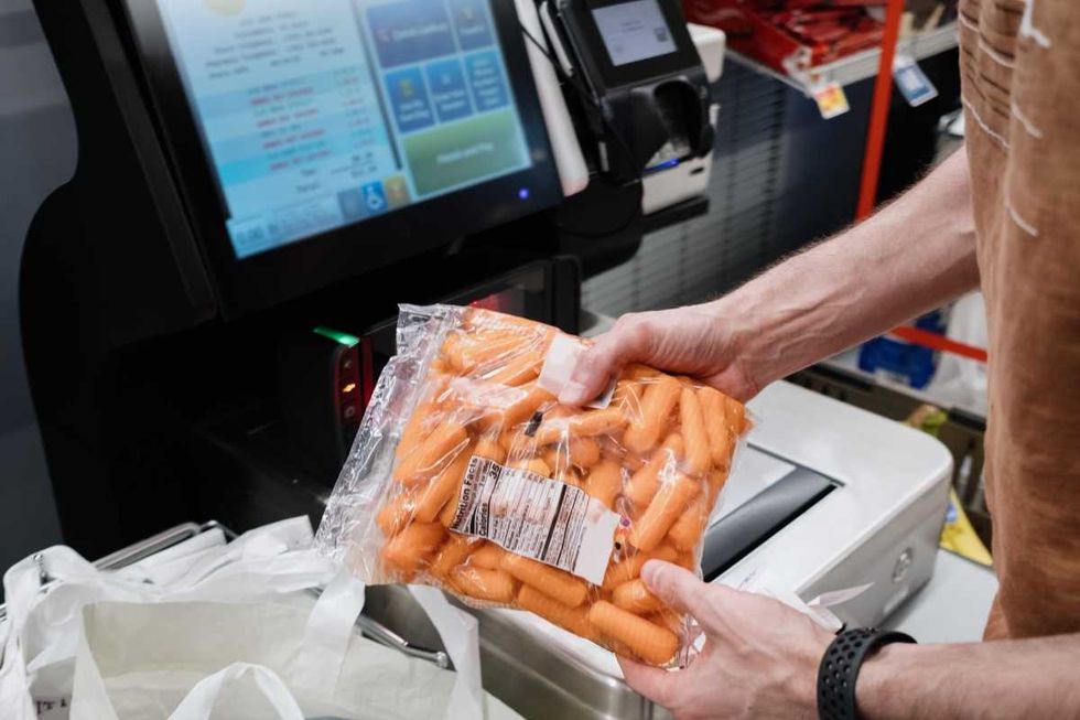 Representative Image Source: Close-up of unrecognizable white man purchasing groceries at self-checkout kiosk in supermarket (Getty Images)