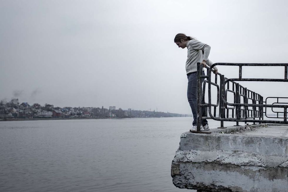 Representative Image Source: Depressed sad frustrated man stands on the edge of the bridge to jump. (Getty Images)
