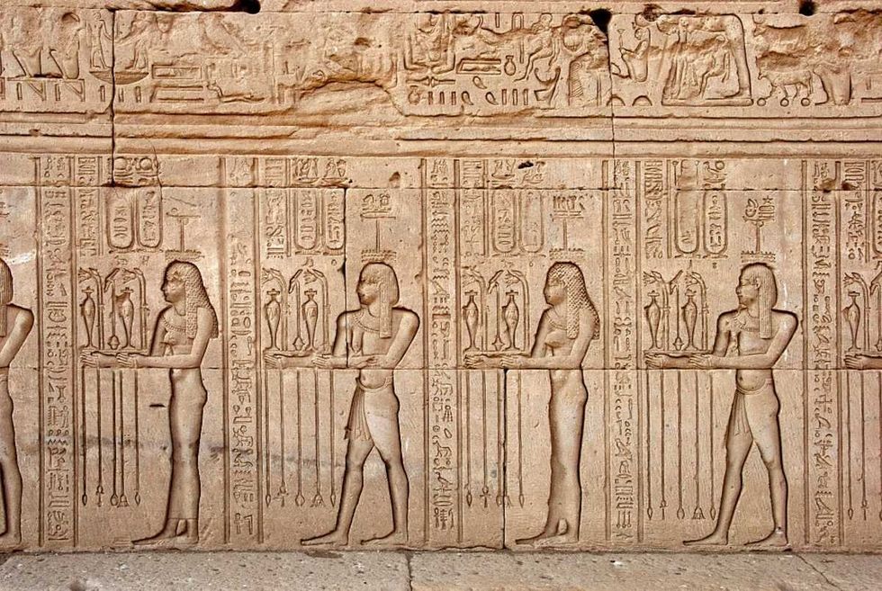 Representative Image Source: Egyptian civilization: offerings and tributes brought to the goddess - Figures carved on the wall of Hathor Temple in Denderah, built under the reign of Pepi I (ca. 2250 BC) (Photo by Leemage/Corbis via Getty Images)