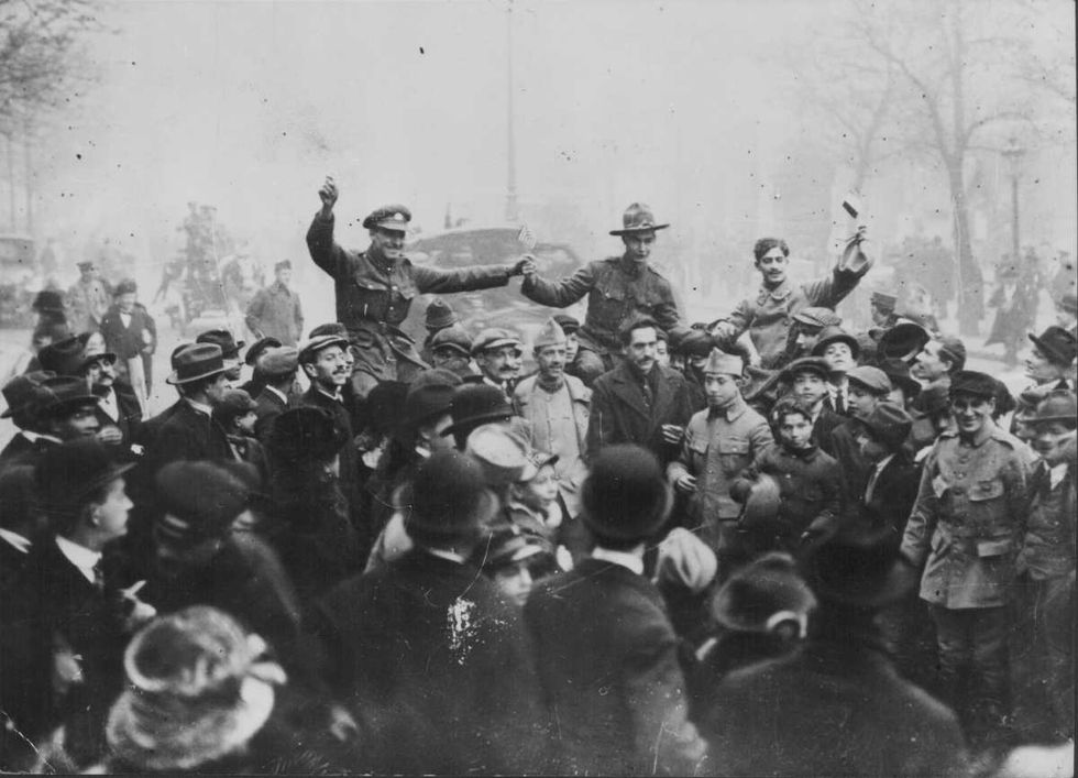 Representative Image Source: French, American and British troops celebrating Armistice Day in France, November 11th 1918. (Photo by Keystone View Company/FPG/Archive Photos/Getty Images)
