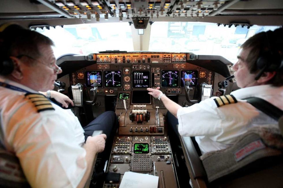 Representative Image Source: Pilots make final checks before flying a consignment of aid from Oxfam's logistics warehouse in Oxfordshire on a British Airways flight bound for Haiti. (Photo by Dan Kitwood/Getty Images)