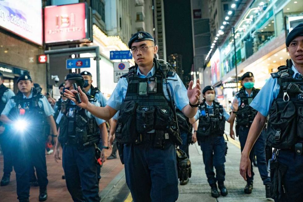 Representative Image Source: Police officers patrol at the Causeway Bay district nearby Victoria Park. (Photo by Anthony Kwan/Getty Images)