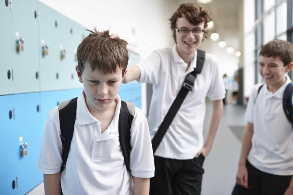 Representative Image Source: Schoolboy being bullied in school corridor (Getty Images)