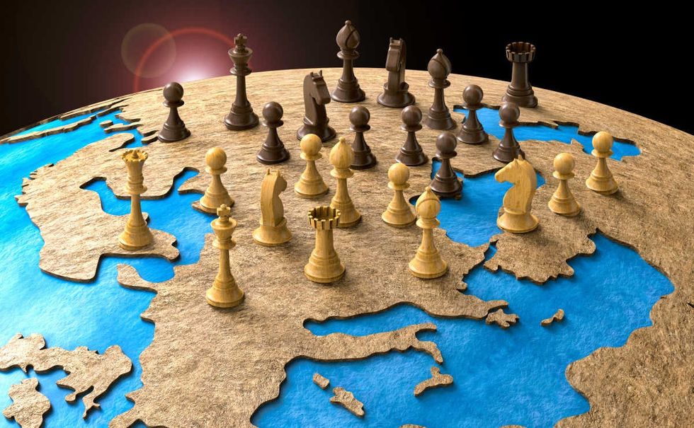 Representative Image Source: Symbol of geopolitics in the world with chess pieces. 3D illustration.