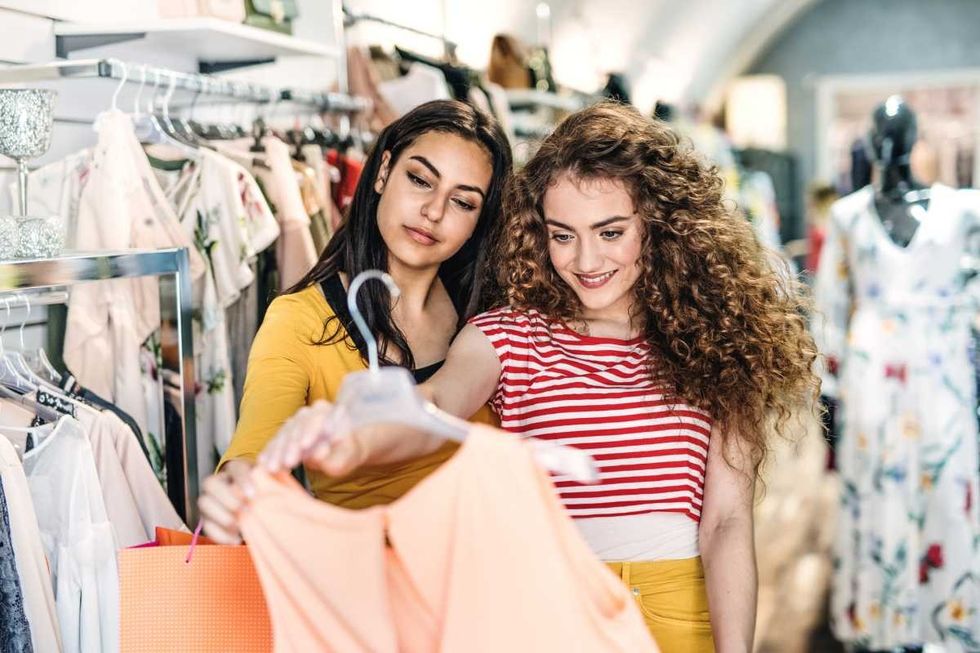 Representative Image Source: Two female teenager friends standing inside in the shop, holding and looking at dress (Getty Images)