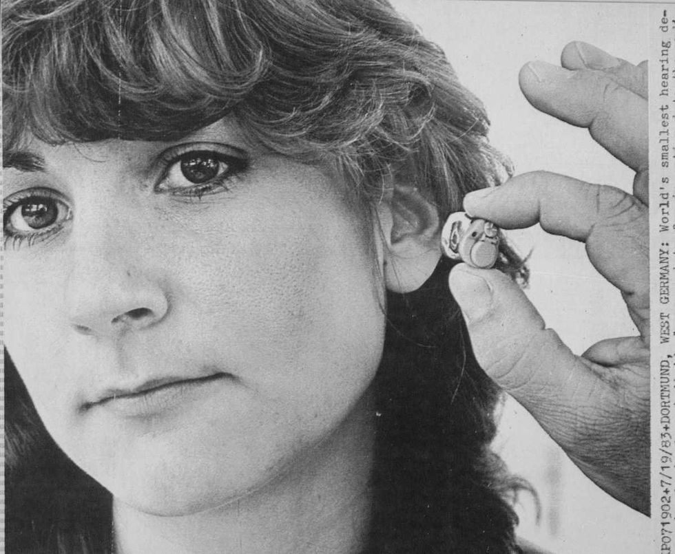 Representative Image Source: World's smallest hearing device, handmade from individual ear prints for insertion into the auditory canal, is smaller than a thimble. (Photo by © Bettmann/CORBIS/Bettmann Archive)