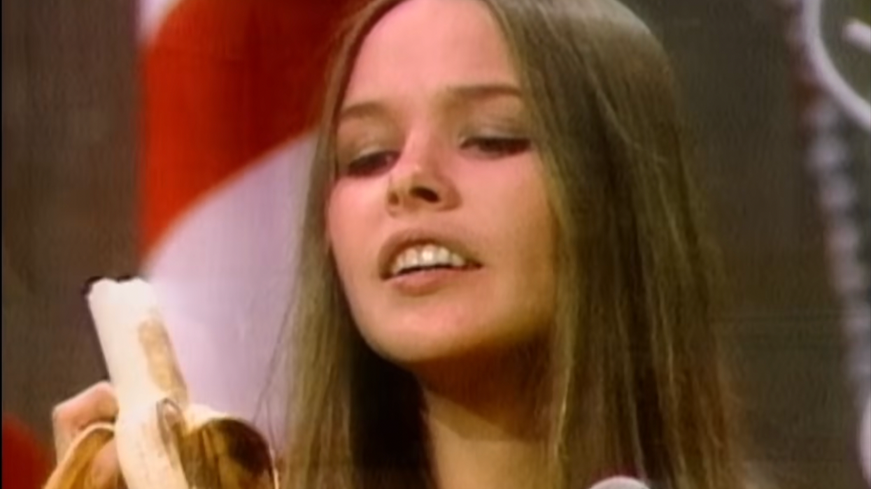 The Mamas & the Papas' Michelle Phillips holds a banana during a performance on 'The Ed Sullivan Show'