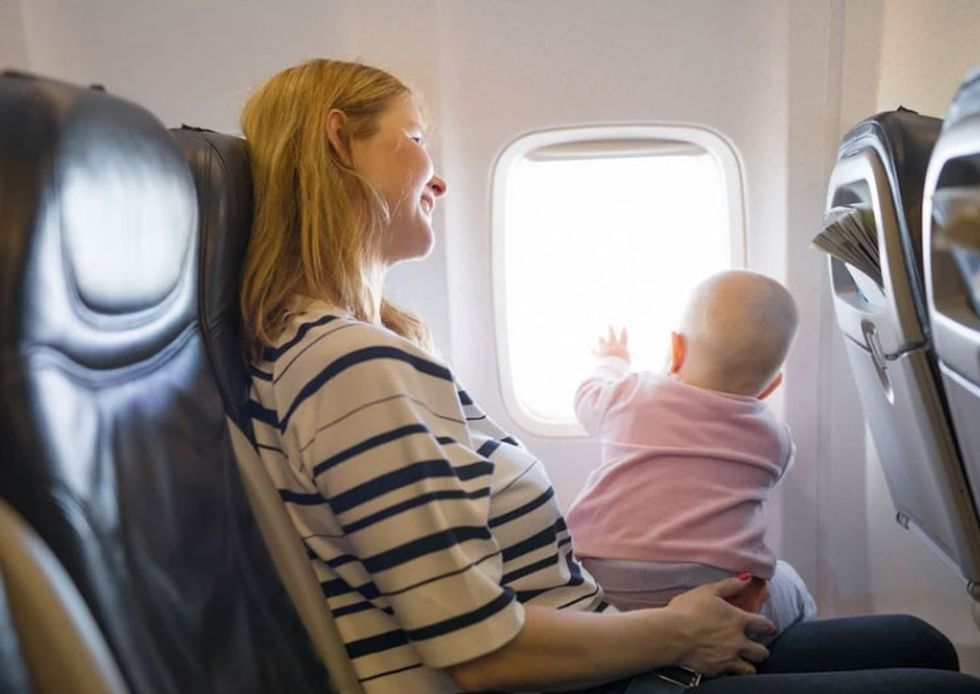 travel with toddlers, parenting forums, flying while pregnant, child seat swap, flight seat issues, mom opinions online