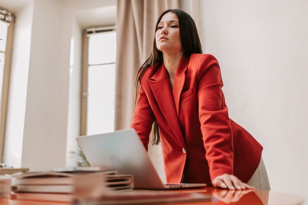 woman in red, posture, laptop, woman on desk, brunette woman