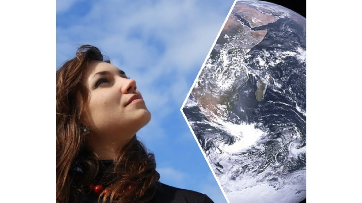 woman looking up toward the sky; earth from space