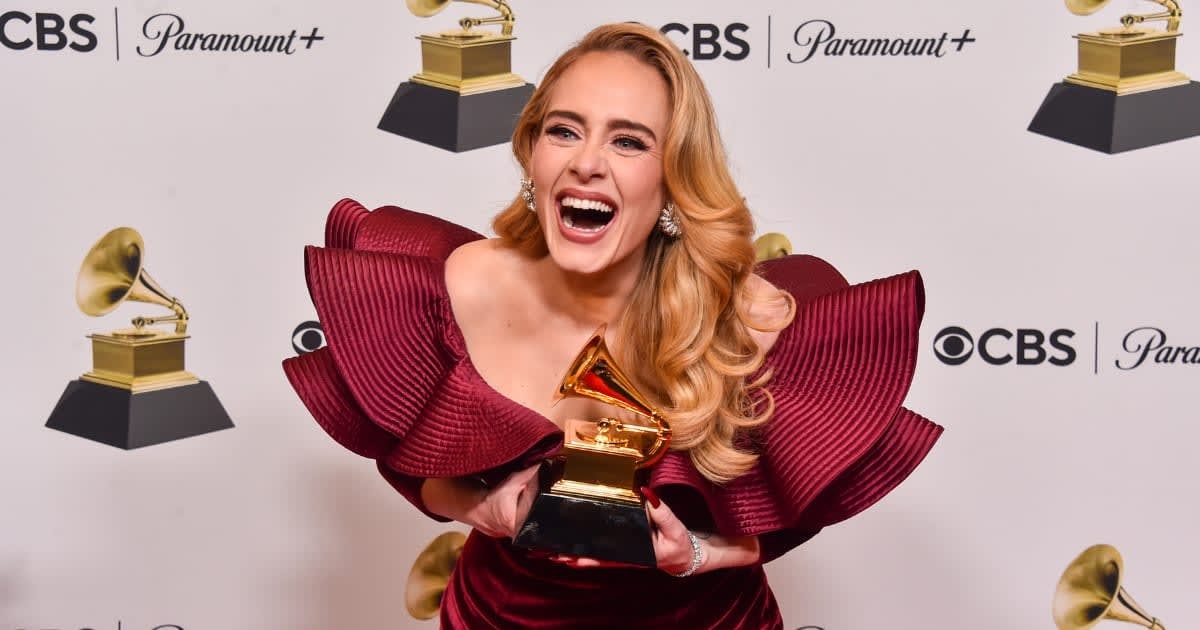 Image Source : Adele poses with the Best Pop Solo Performance Award for