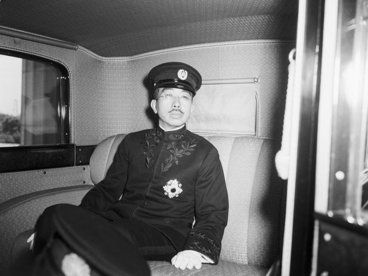 Image Source: Emperor Hirohito leaving the National Diet of Japan after making a speech to the open session. He is shown in his limousine.