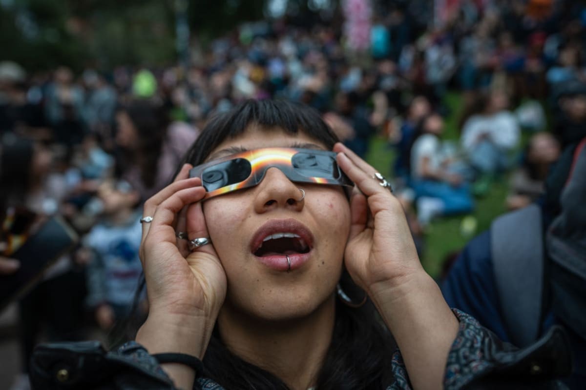 Image source: People surprises to see the eclipse despite the cloudy sky during an annular solar eclipse at Planetarium of Bogota on October 14, 2023 in Bogota, Colombia. (Photo by Diego Cuevas/Getty Images)
