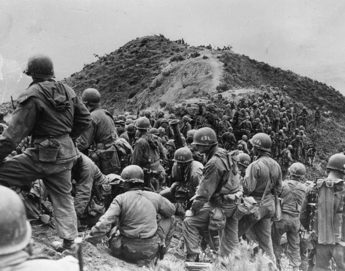 Image Source: 3rd May 1951: Men of the 187th US Regimental Combat Team prepare to take a ridge position somewhere in Korea. (Photo by Keystone/Getty Images)