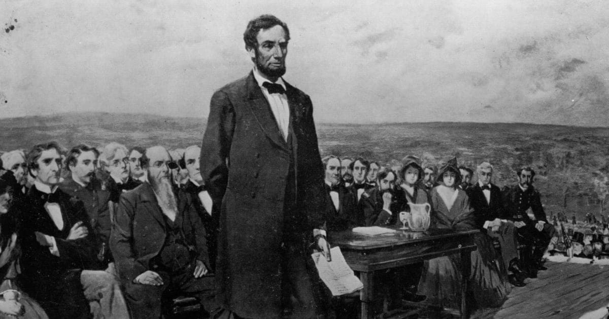 Image Source : Abraham Lincoln, the 16th President of the United States of America, making his famous 'Gettysburg Address' speech at the dedication of the Gettysburg National Cemetery during the American Civil War. Original Artwork: Painting by Fletcher C Ransom (Photo by Library Of Congress/Getty Images)