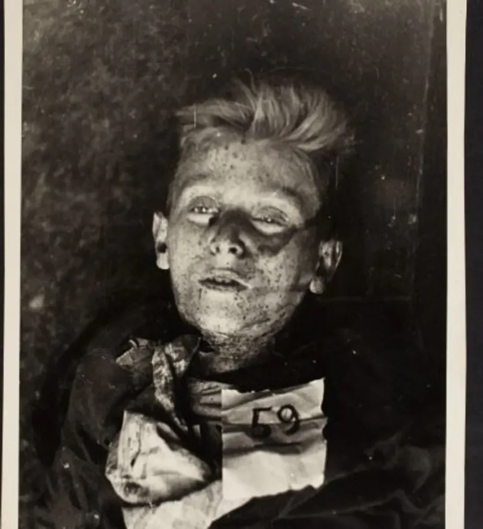 A dead boy labeled number 59.