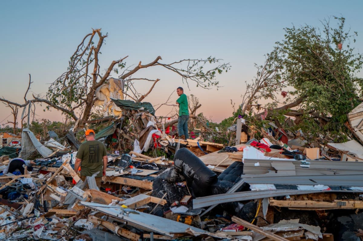 Image Source: The EF3 twister that struck claimed one life and destroyed dozens of homes in the community of just over 1,000 people. (Photo by Brandon Bell/Getty Images)