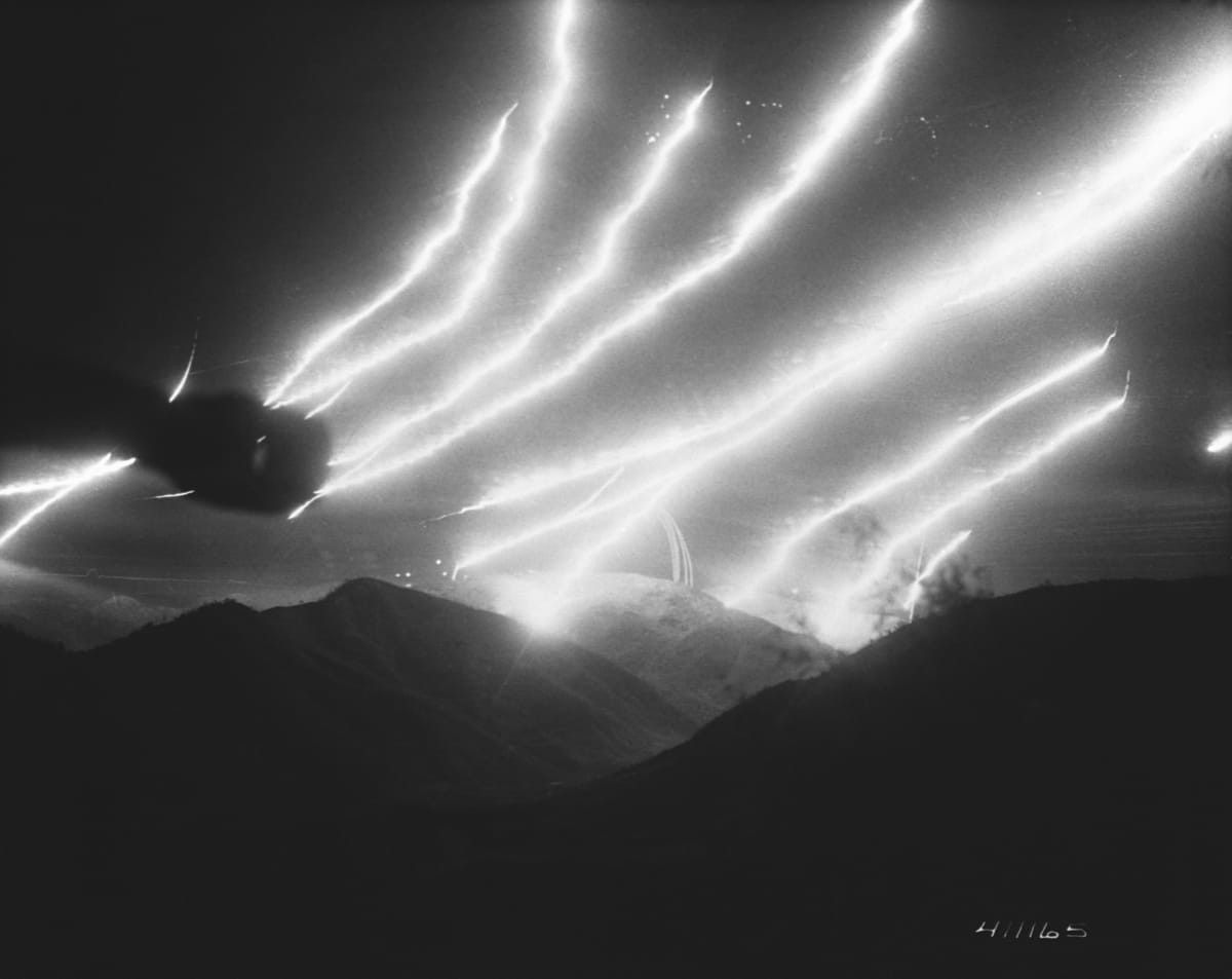 Image Source: Tracers and flares leave streaks in the night sky. (Photo by © CORBIS/Corbis via Getty Images)