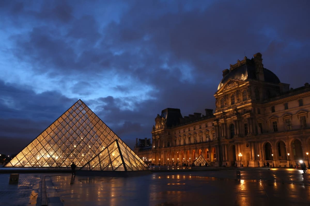 Image Source: The Louvre museum is pictured at dusk on March 05, 2024 in Paris, France. (Photo by Pascal Le Segretain/Getty Images)