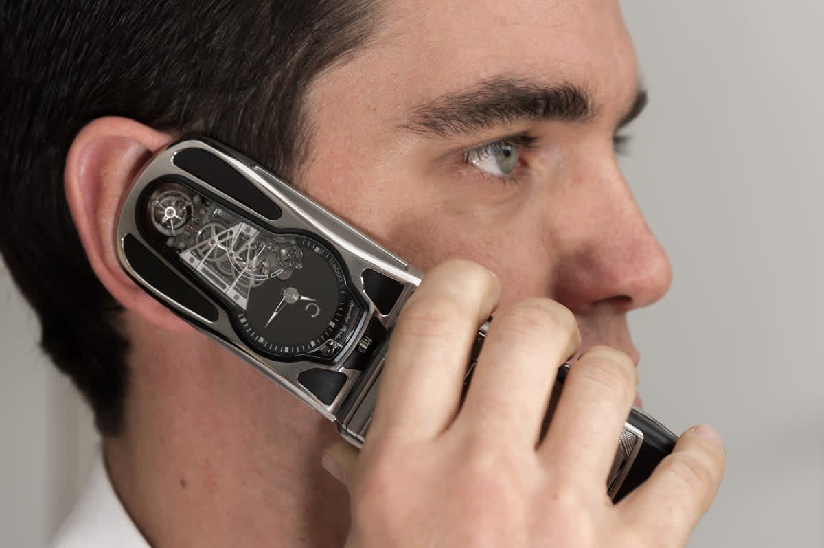Image Source: Edouard Meylan, Celsius Co-founder, uses a LeDIX Origine mechanical mobile phone made by Celsius X VI II on September 17, 2012 in Geneva, Switzerland. (Photo by The Image Gate/Getty Images)