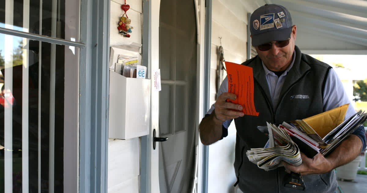 Representative Image Source: US Postal Service letter carrier Dennis Stecz delivers mail on January 28, 2009 in San Lorenzo, California. (Photo by Justin Sullivan/Getty Images)