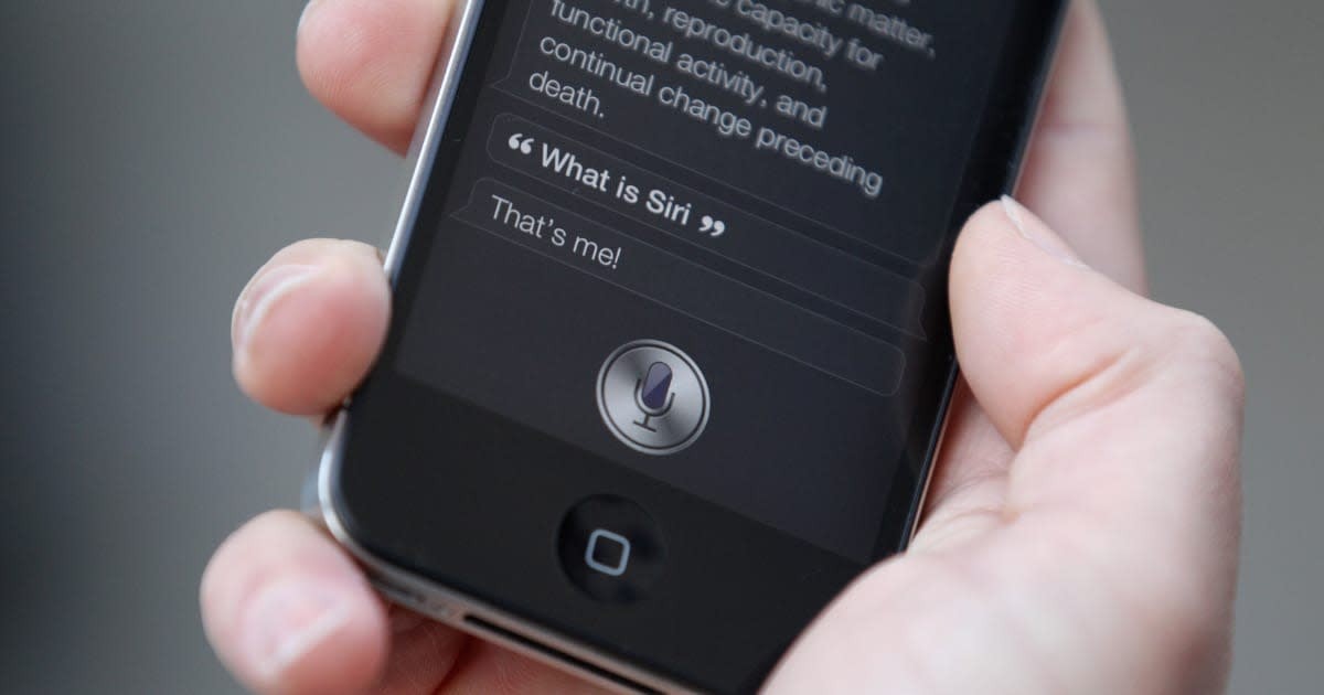 Image Source: A man uses 'Siri' on the new iPhone 4S after being one of the first customers in the Apple store in Covent Garden on October 14, 2011 in London, England.(Photo by Oli Scarff/Getty Images)