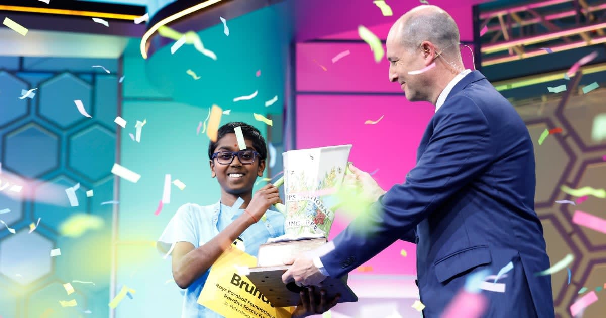 Image Source: Twelve-year-old Bruhat Soma, of Tampa, Florida, is handed the Scripps Cup by E. W. Scripps Company CEO Adam Symson after winning the 2024 Scripps National Spelling Bee at the Gaylord National Resort and Convention Center on May 30, 2024 in National Harbor, Maryland. (Photo by Anna Moneymaker/Getty Images)