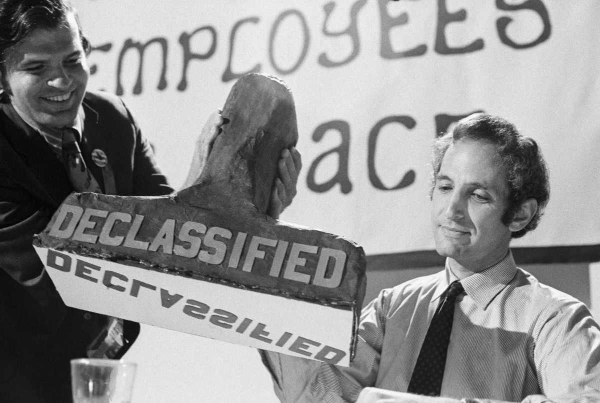 Representative Image Source: Daniel Ellsberg being presented with a papier mache