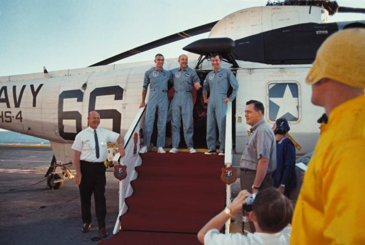 Image Source: Apollo 10 astronauts (L-R): Eugene Cernan, Thomas Stafford and John Young, stand smiling after their successful splashdown May 26th.