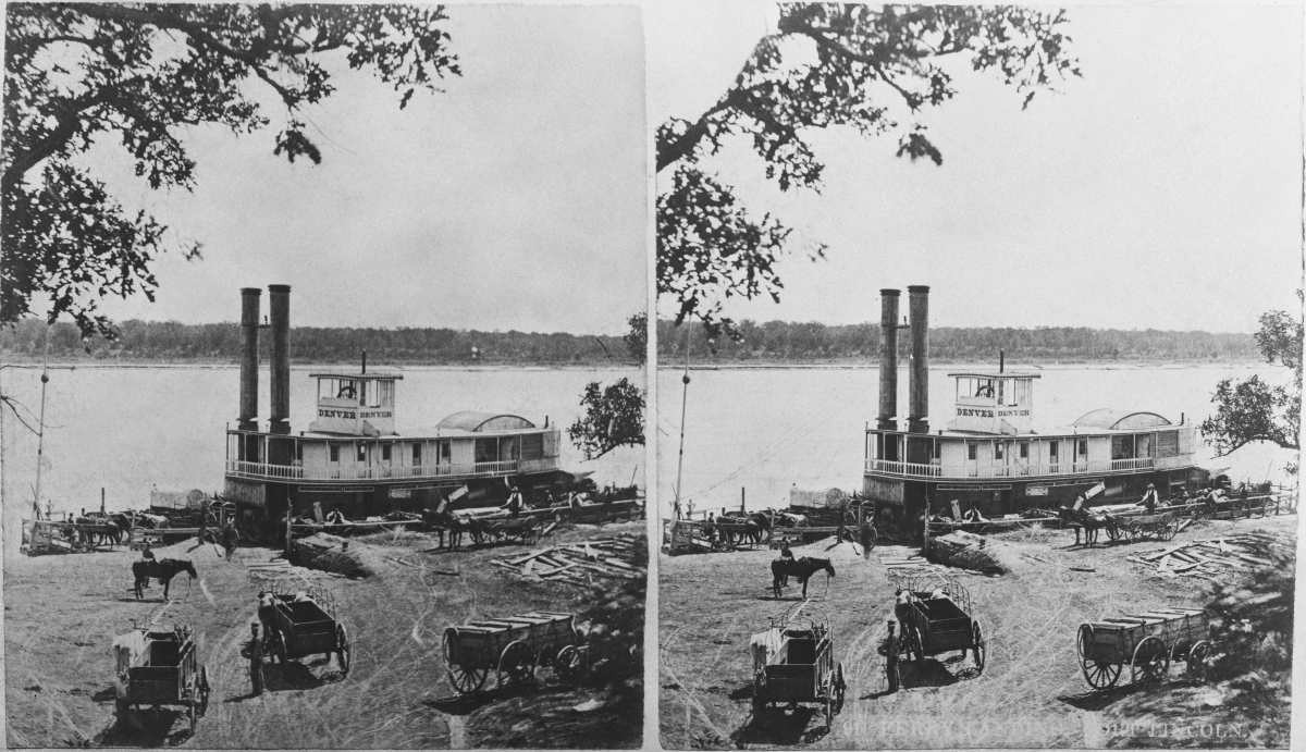 Image Source: Stereoscopic image showing horse-drawn carts on the east bank of the Missouri River, with the steamboat 'Denver' - with covered wagons on the deck - moored to the riverbank at the Fort Lincoln military post, in Bismarck, North Dakota, 1895. (Photo by Graphic House/Archive Photos/Getty Images)