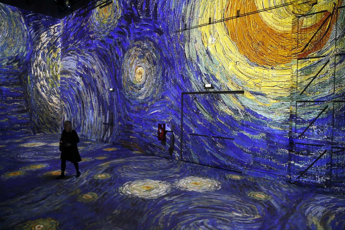 Cover Image Source: Visitors attend a press preview of the immersive exhibition