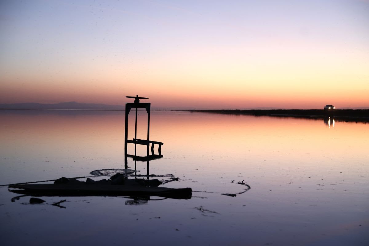 Representative Image Source: A vehicle drives near inundated farmland in the reemerging Tulare Lake, in California on April 26, 2023. (Photo by Mario Tama/Getty Images)