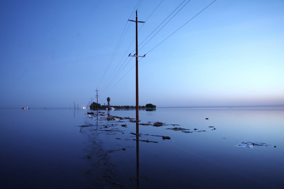 Representative Image Source: Floodwaters cover a road in the reemerging Tulare Lake, in California in April 2023. (Photo by Mario Tama/Getty Images)