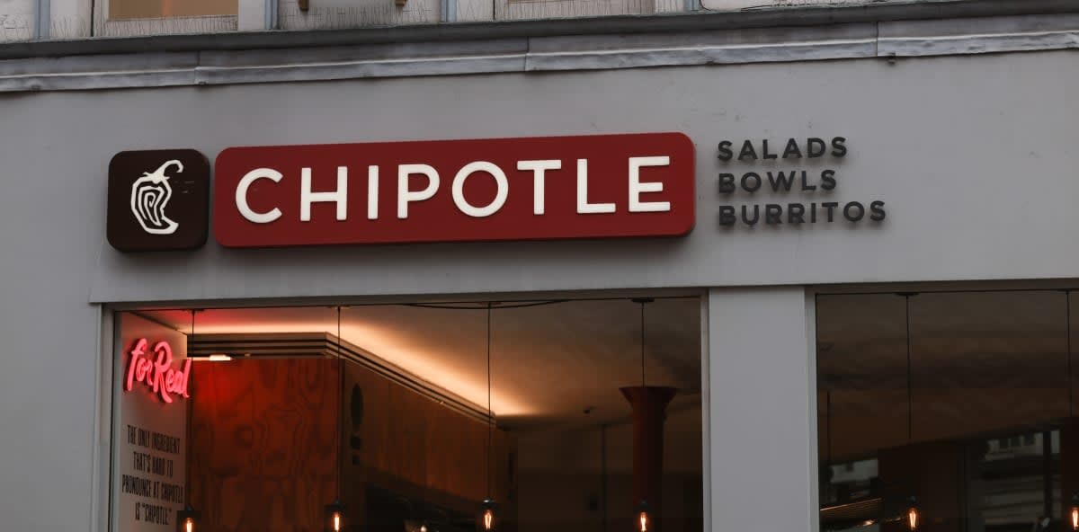 Image Source: The exterior of a Chipotle Mexican Grill store photographed on February 18, 2023 in London, England. (Photo by Jeremy Moeller/Getty Images)