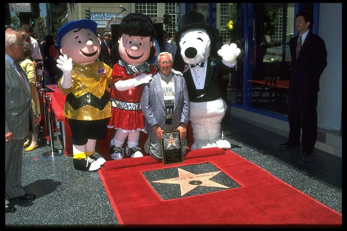 Image Source: Charles Schulz with the characters of 'Peanuts' : Charlie Brown, Lucy & Snoopy. (Photo by Frank Trapper/Corbis via Getty Images)