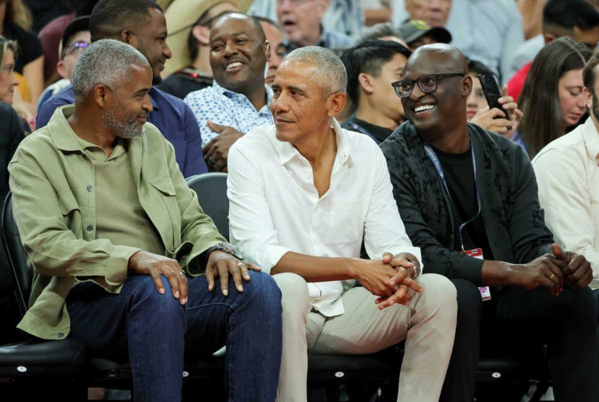 Image Source: Former U.S. President Barack Obama (C) and Robbie Robinson (R) ahead of the Paris Olympic Games on July 10, 2024 in Las Vegas, Nevada.(Photo by Ethan Miller/Getty Images)