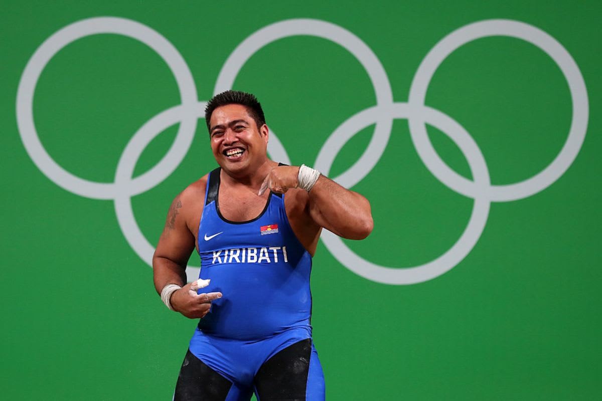 Image Source: David Katoatau of Kiribati reacts during the Men's 105kg Group B Weightlifting event in Rio de Janeiro, Brazil. (Photo by Tom Pennington/Getty Images)