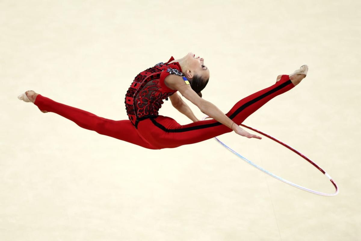 Image Source: Taisiia Onofriichuk of Team Ukraine competes during the Rhythmic Gymnastics Individual All-Around Qualification at Porte de La Chapelle Arena on August 08, 2024 in Paris, France. (Photo by Naomi Baker/Getty Images)
