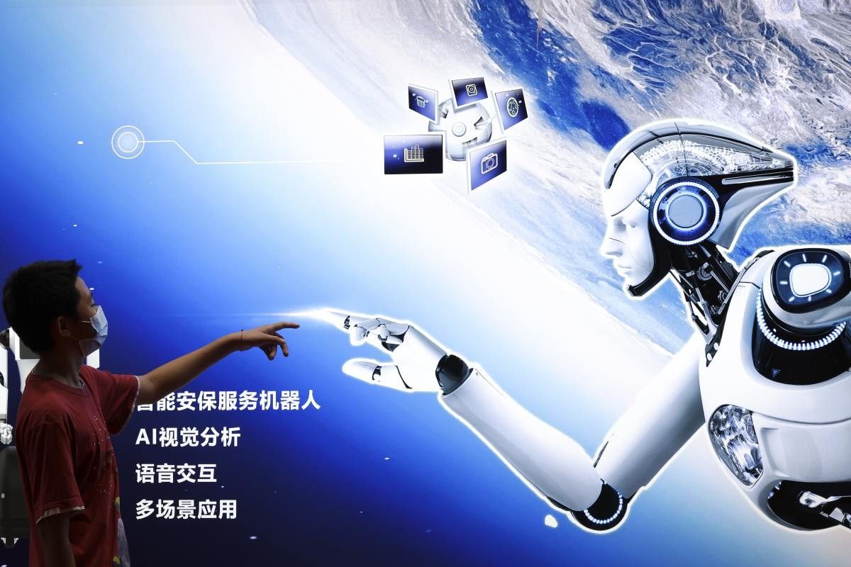 Representative Image Source: A boy points to the AI robot Poster during 2022 World Robot Conference on August 18, 2022 in Beijing, China. (Photo by Lintao Zhang/Getty Images)