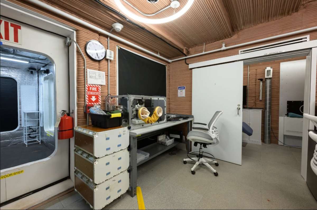 Image Source: During the one-year analog mission, crew members will participate in various activities, including sample collection and analysis utilizing a glovebox. Bill Stafford/NASA