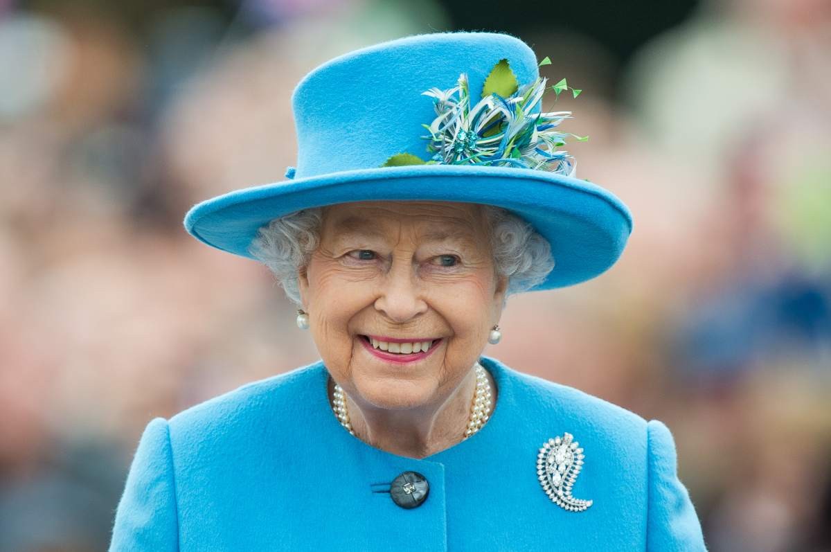 Image Source: Queen Elizabeth II tours Queen Mother Square on October 27, 2016 in Poundbury, Dorset. (Photo by Samir Hussein/WireImage)
