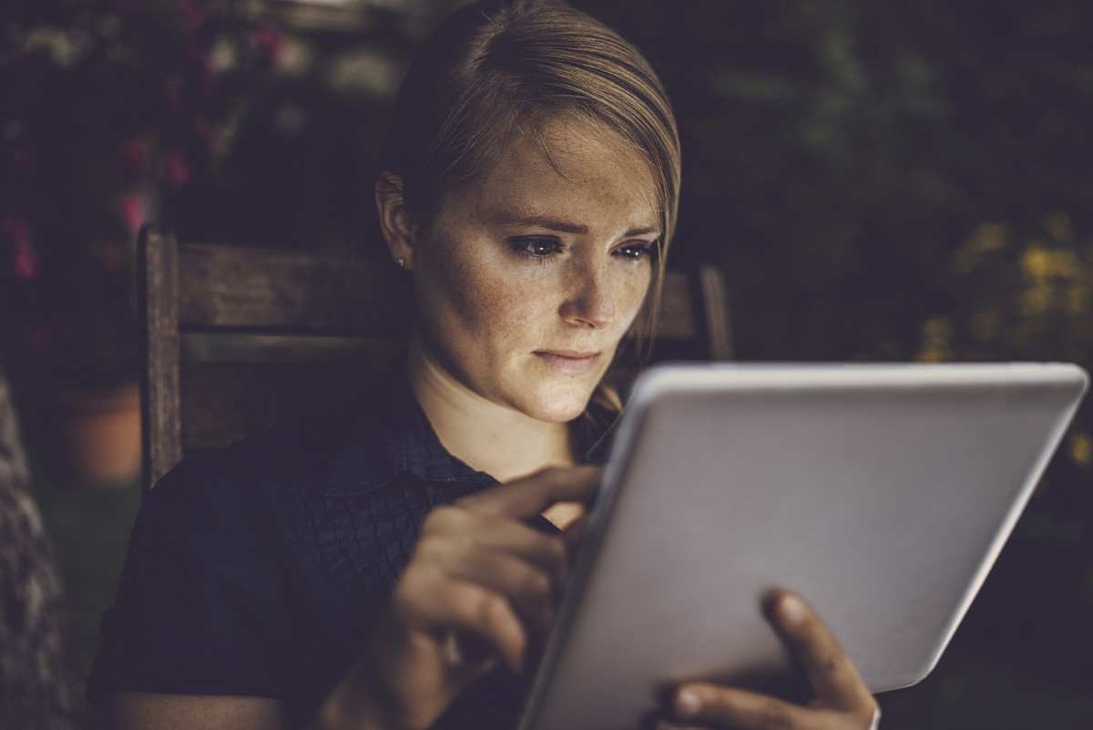 Representative Image Source: Blondhaired woman using smart device in garden, face is lit by the tablet screen. (Getty Images)