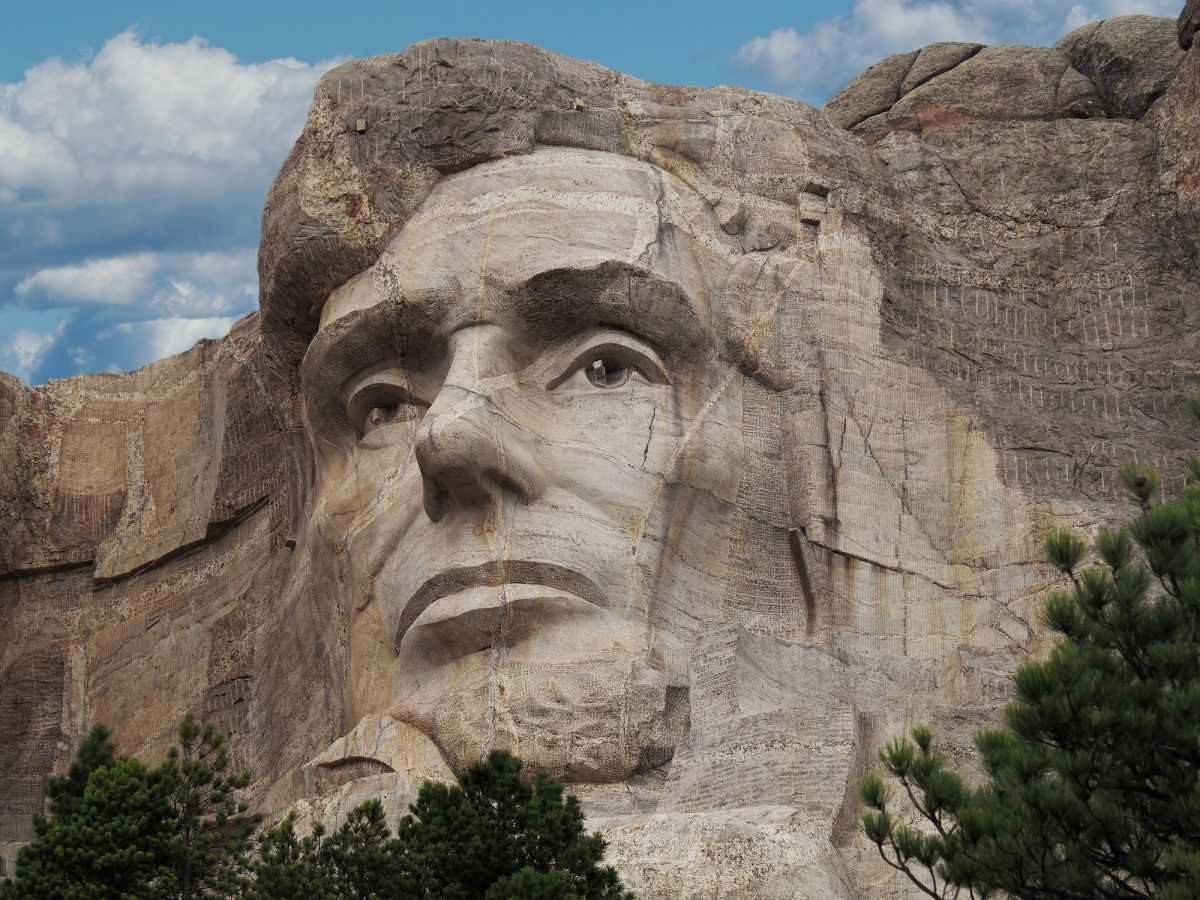 Image Source: The head of Abraham Lincoln President of the United States, sculpted into the granite rock of Mount Rushmore in the Black Hills of South Dakota. (Getty Images)