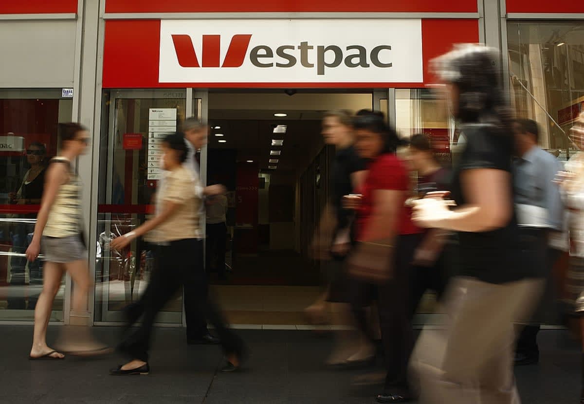 Image source: Pedestrians walk past a Westpac branch in Sydney on February 3, 2009, in Sydney, Australia. (Photo by Brendon Thorne/Getty Images)